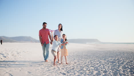 Family,-parents-and-children-on-beach-with-plane