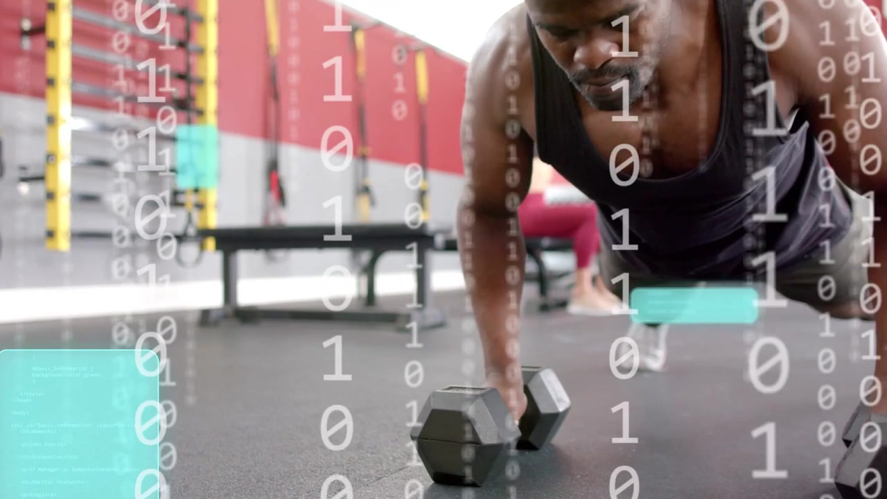 Mid adult man lowering chest pushing up rowing dumbbell for strength causing HUD binary over gym