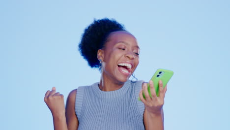 black woman, excited and phone in studio