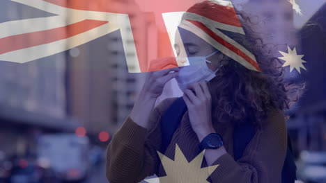 bandera australiana ondeando contra una mujer con máscara facial