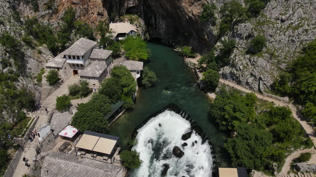 Flight over the river, Blagaj Tekija, Mostar, Bosnia, historic religious building built on the water's edge