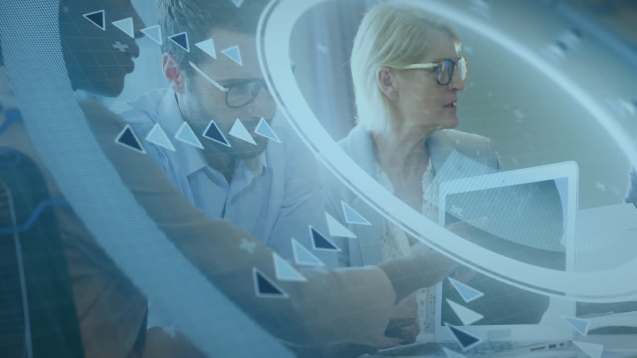 Collaborating on animation project, business team using digital interface in office