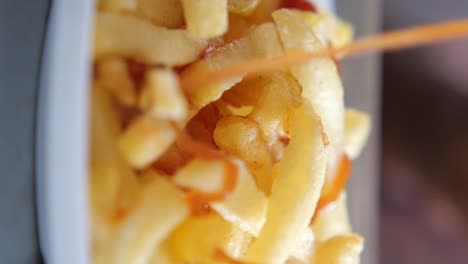 close up of french fries with ketchup
