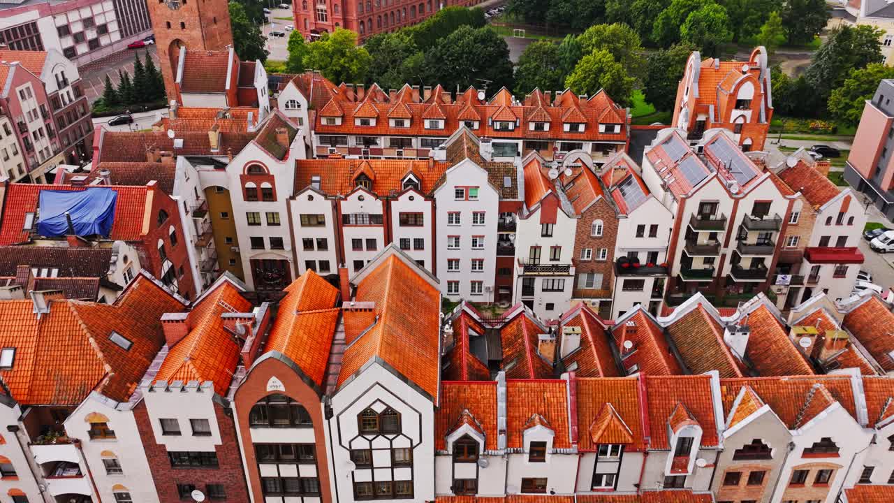 Cinematic flight above Elbląg Old Town, red tiled rooftops and hidden charm