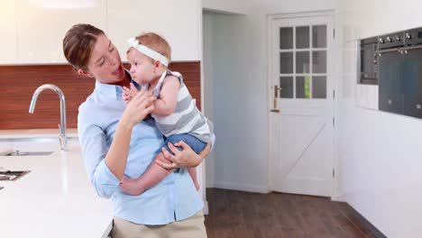 Happy-mother-playing-with-her-baby