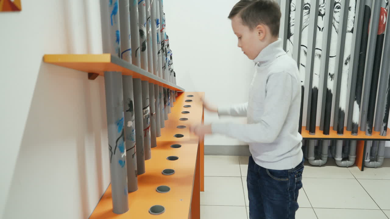 Boy conducts research experience. Museum of entertaining sciences