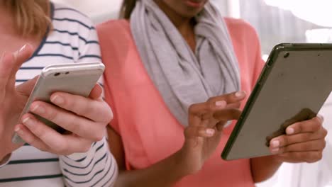 Casual-business-team-using-tablets-and-phones