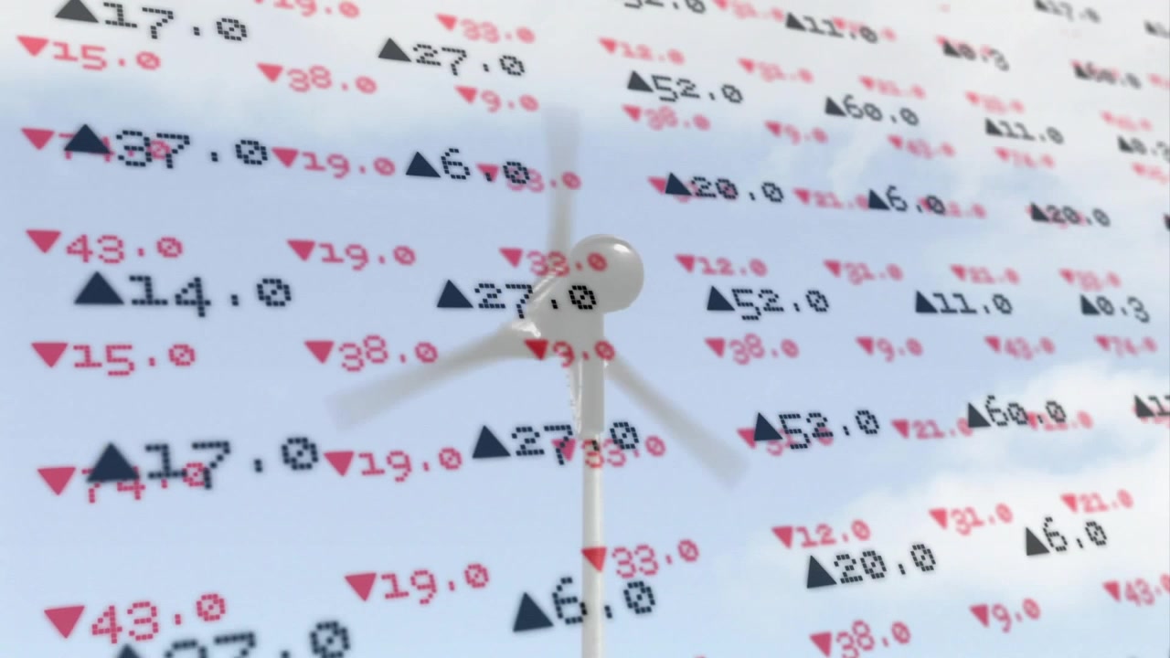 Otáčející se rotor turbíny ve větru, číselné překrytí fixované přes záběr zobrazující energetické metriky.