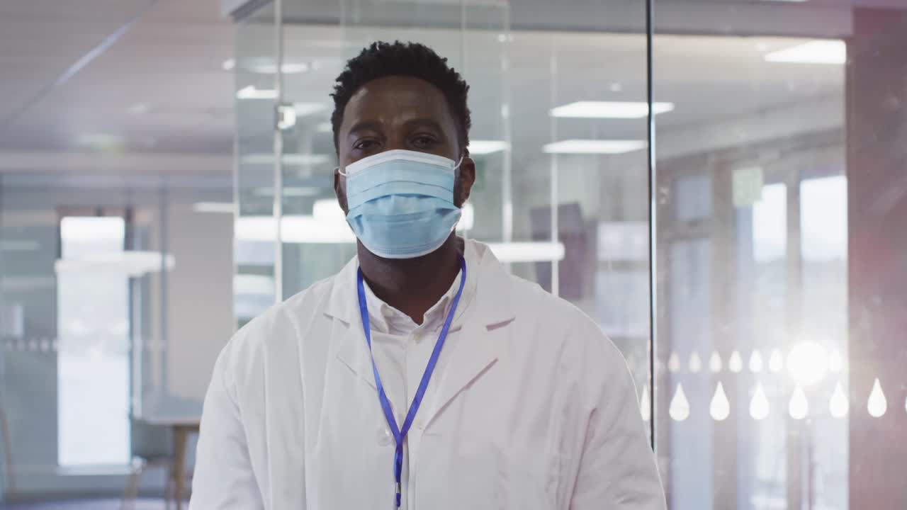 Portrait of male doctor wearing face mask in hospital