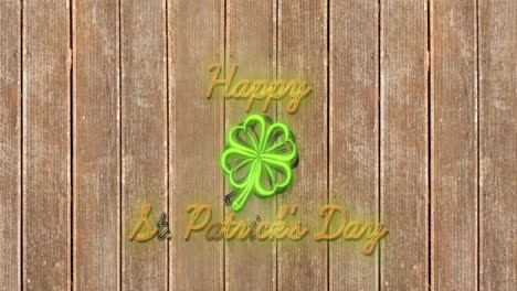 happy saint patrick's day text animation over wooden background with neon shamrock