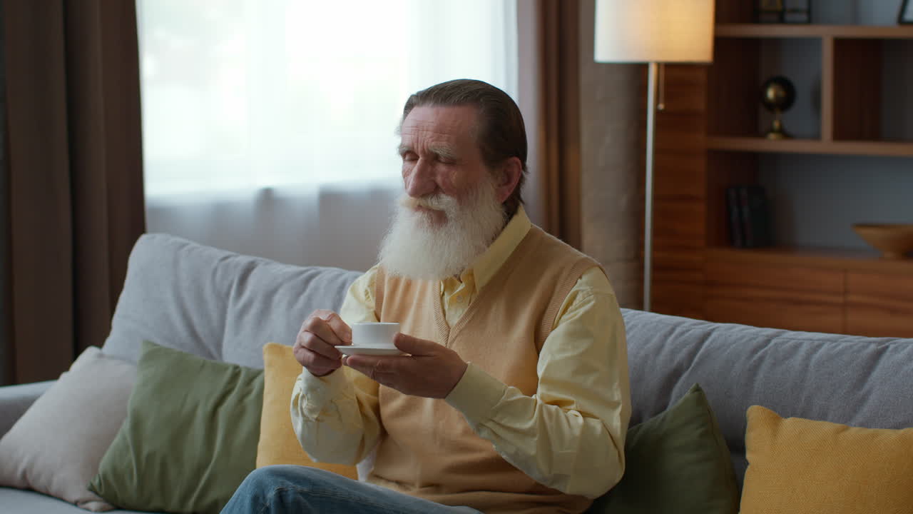 Senior Man Relaxing with a Drink at Home
