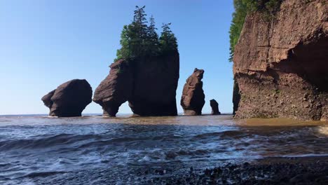 high tides crash against the shore at bay of fundy