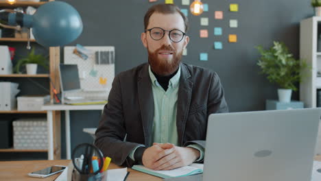 man in office video call