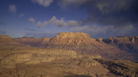 stunning landscape view of a desert plateau under cloudy skies at dusk