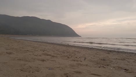 Sand,-sea-and-mountain-behind