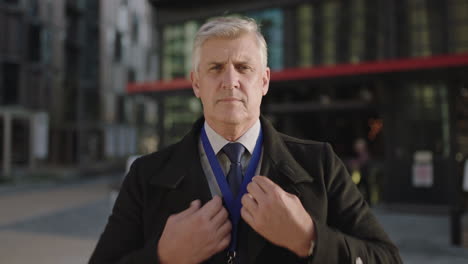 portrait of professional businessman getting ready for meeting looking confident in city