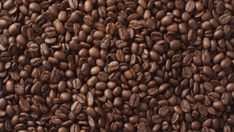 video of close up of pile of close up roasted brown coffee beans