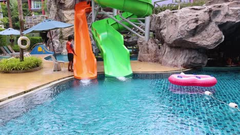 lifeguard supervises water slide activity