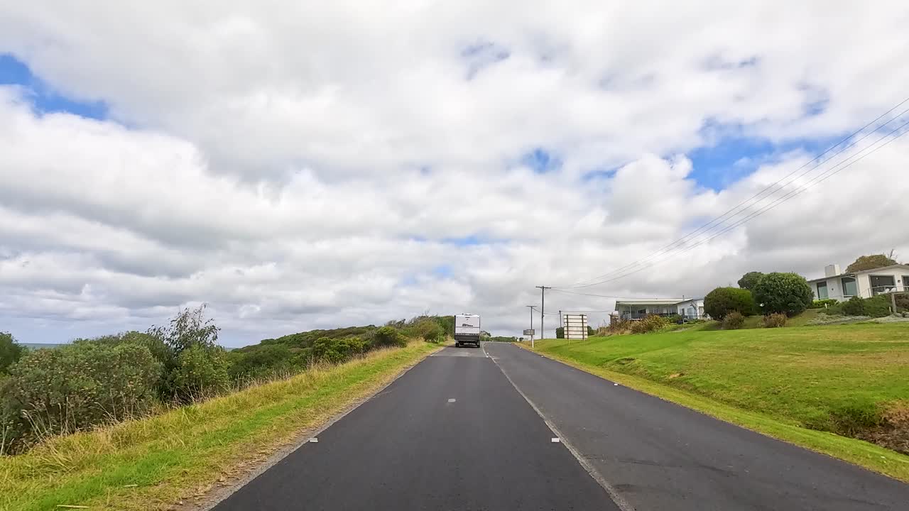 A 30-second drive showcasing lush greenery, coastal views, and clear skies on the Great Ocean Road