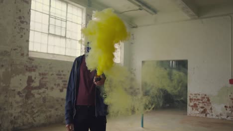 fashionable young man in an abandoned warehouse