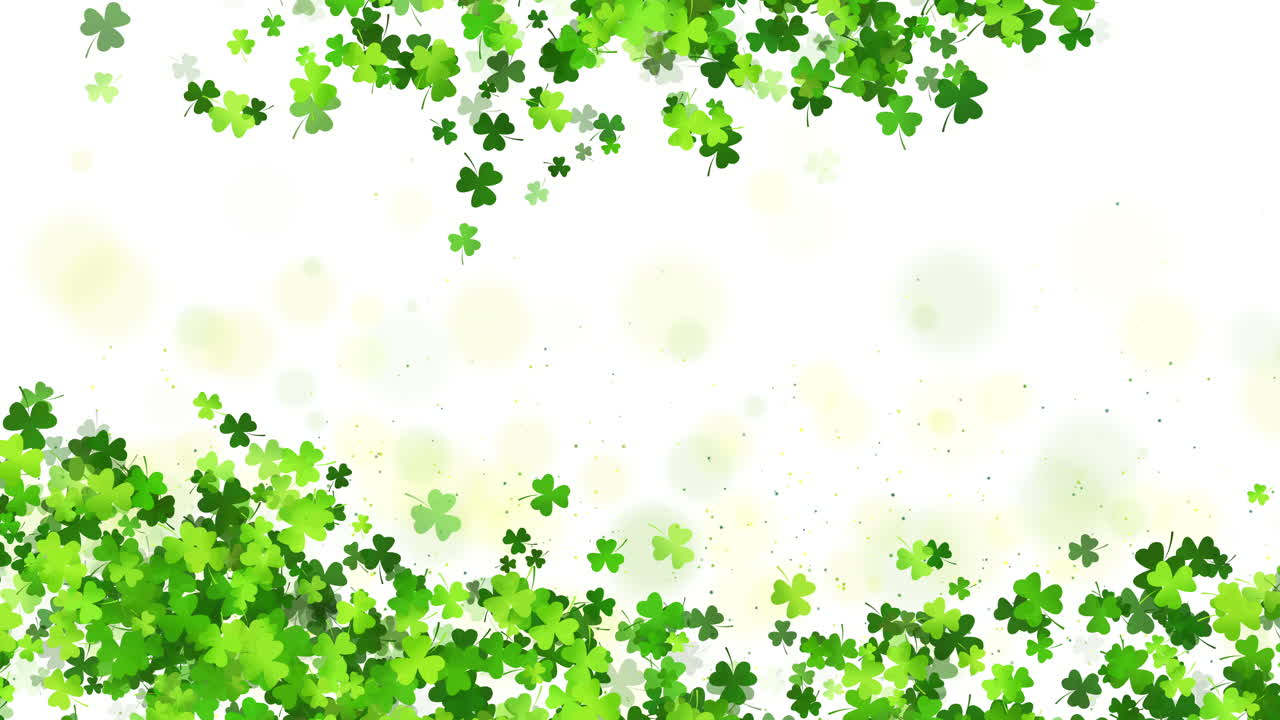 Saint Patricks day background with sprayed clover shamrocks. Green frame of leaves on white looped background. Copy space.