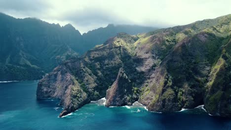 drone view of cloud cover changing light on lush island ridges on fatu hiva island in the marquesas islands south pacific french polynesia