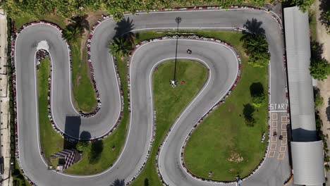 aerial view of a go-kart track with cars racing