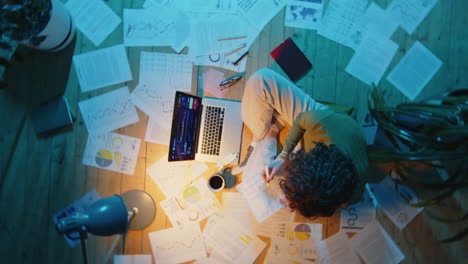 woman working with financial papers during night