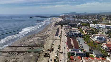 Aerial-shot-flying-down-the-beach-in-Oceanside-California