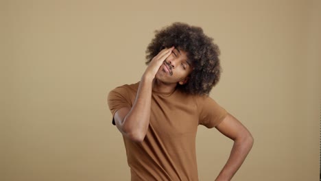 young man with afro hair expressing various moods in a studio