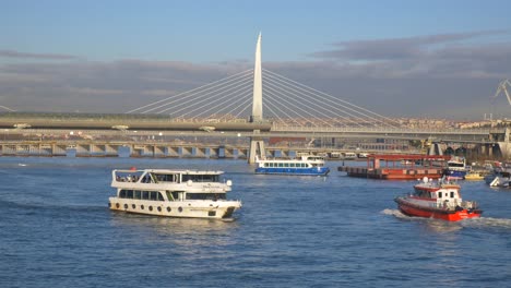 istanbul cityscape: boats on the bosphorus with a modern bridge in the background