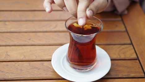 woman enjoying turkish tea outdoors