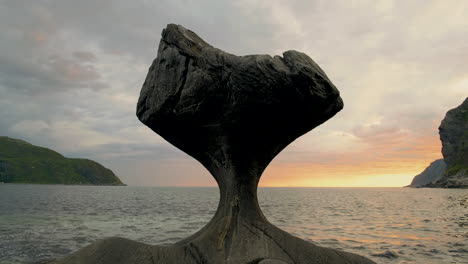 mushroom-shaped rock formation of kannesteinen rock in oppedal, norway