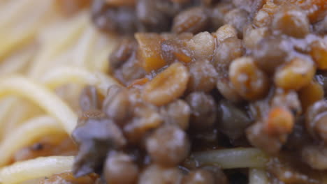 vegan spaghetti, vegan pasta dish, lentil pasta. spinning bowl of vegetarian pasta