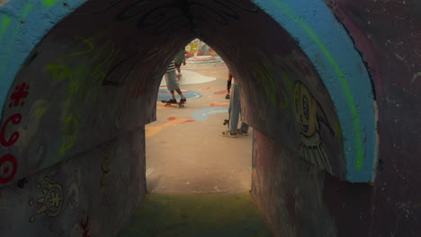 graffiti-covered skate park tunnel
