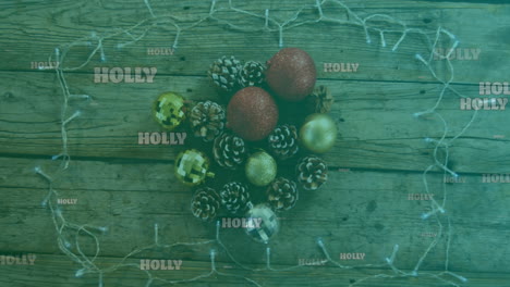 animation of holly text in white, on green over christmas decorations and fairy lights