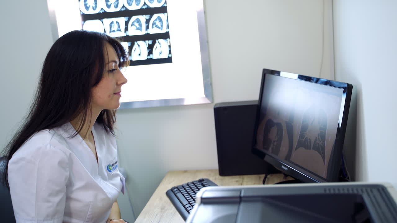 Doctor reviewing medical images on computer