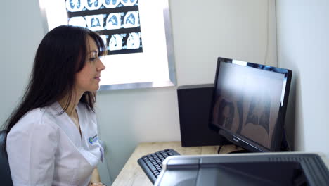 Doctor reviewing medical images on computer