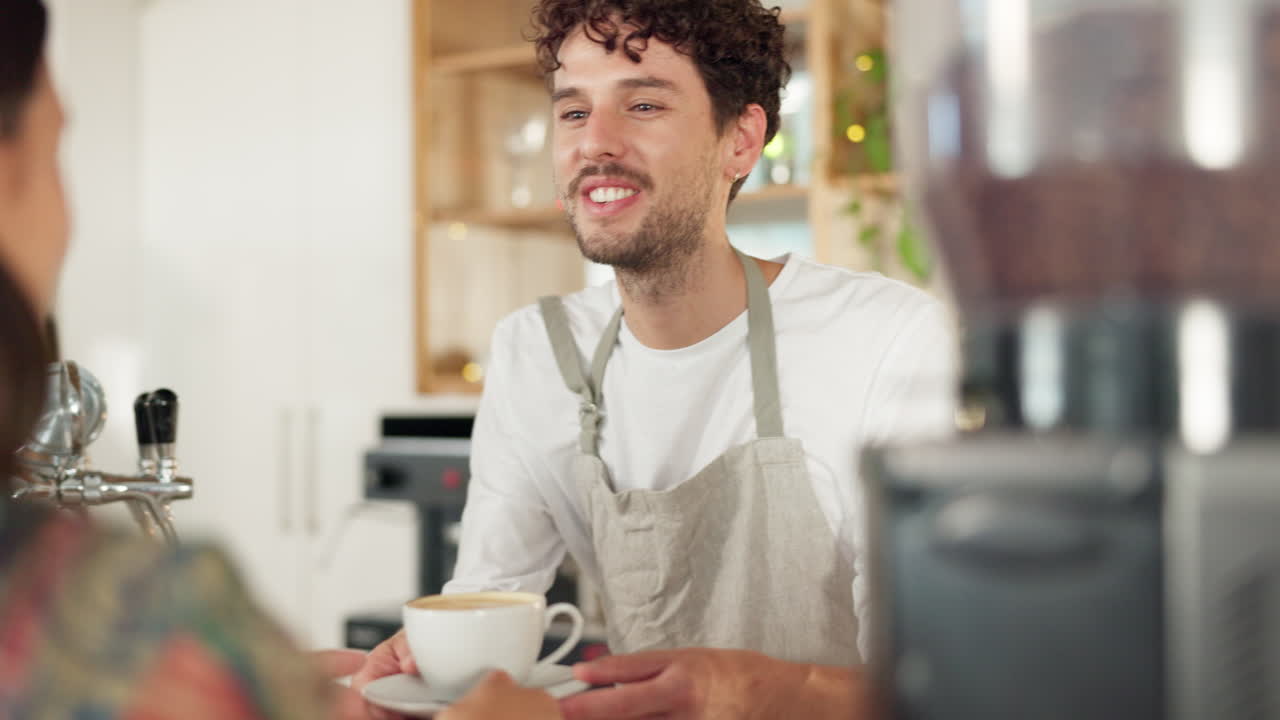 Barista serving customer, smile in coffee shop