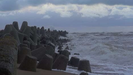 stormy sea waves hitting the port pier in slow motion