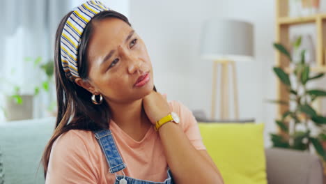 Asian-woman,-neck-pain-and-burnout-on-living-room