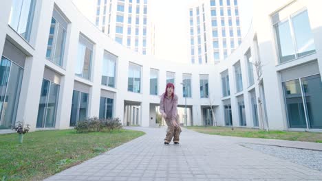 young urban dancer performing energetic freestyle moves in modern city setting