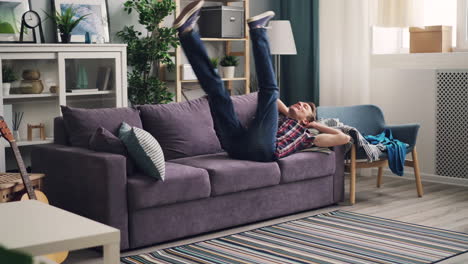 man relaxing on couch