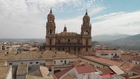 Spain-Jaen-Cathedral,-Catedral-de-Jaen,-flying-shoots-of-this-old-church-with-a-drone-at-4k-24fps-using-a-ND-filter-also-it-can-be-seen-the-old-town-of-Jaen