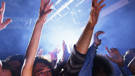 group of people dancing at a concert 4k