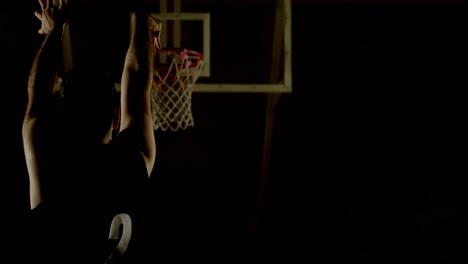 male basketball player throwing basketball in the basketball hoop 4k