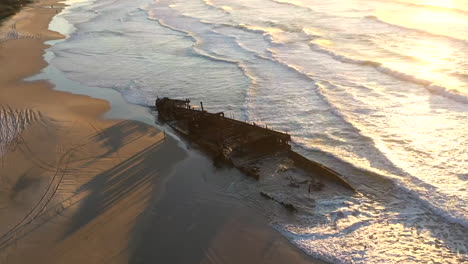 orbiting drone time lapse of the ss maheno shipwreck on fraser island, australia