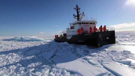 research vessel navigating through arctic ice