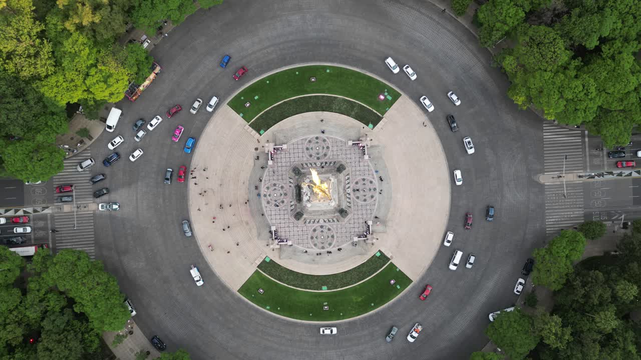 A wide drone view Time Lapse of The Angel of Independence Square in Mexico City.