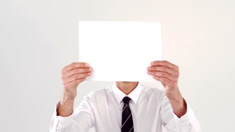 businessman holding white blank paper